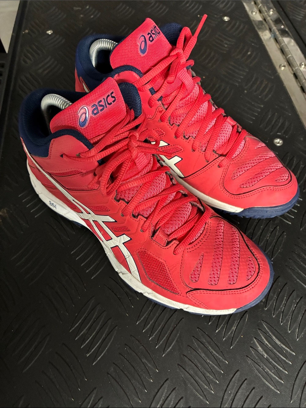 Asics Women's red / pink mid high top volleyball sneakers